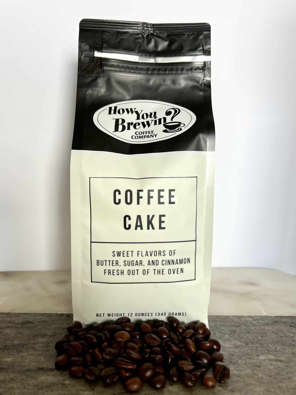 Coffee-Cake-coffee-packaging-stands-on-coffee-beans-scaled