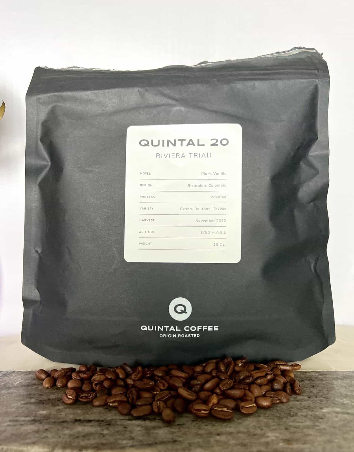 Coffee-Quintal-No.-20-Riviera-Triad-stands-on-coffee-beans-scaled