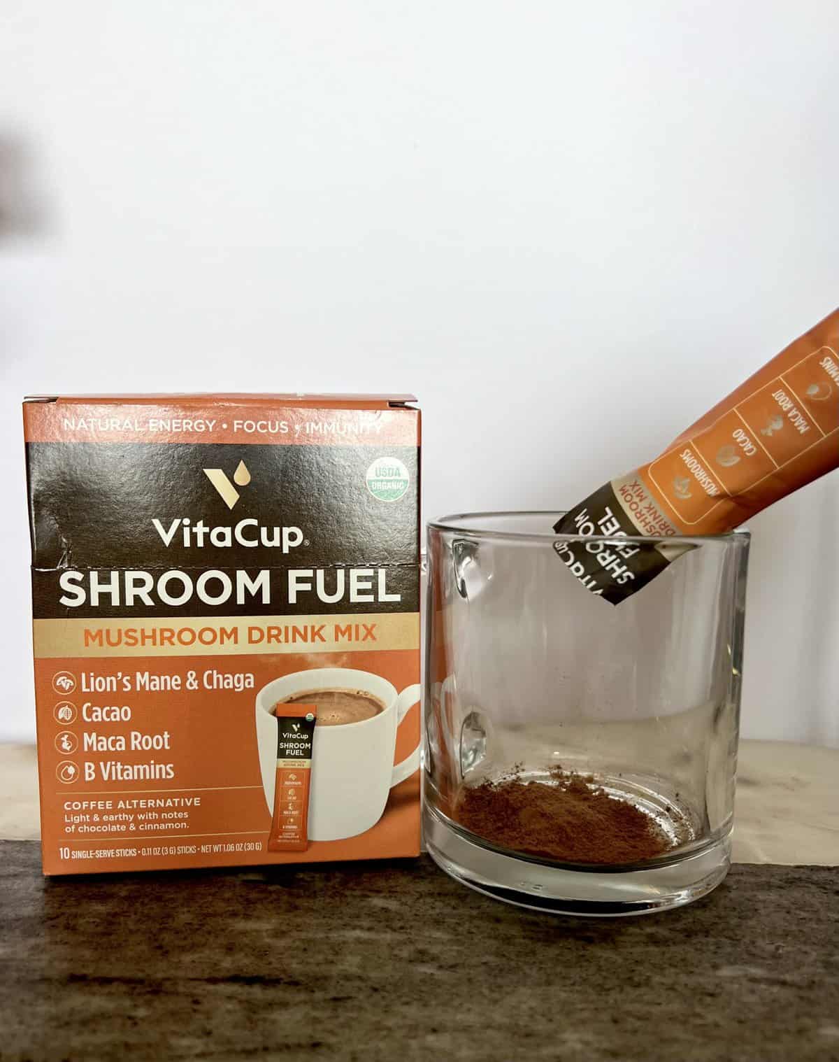 VitaCup-Shroom-Fuel-Mushroom-Based-Coffee-next-to-a-cup-of-coffee-powder-scaled