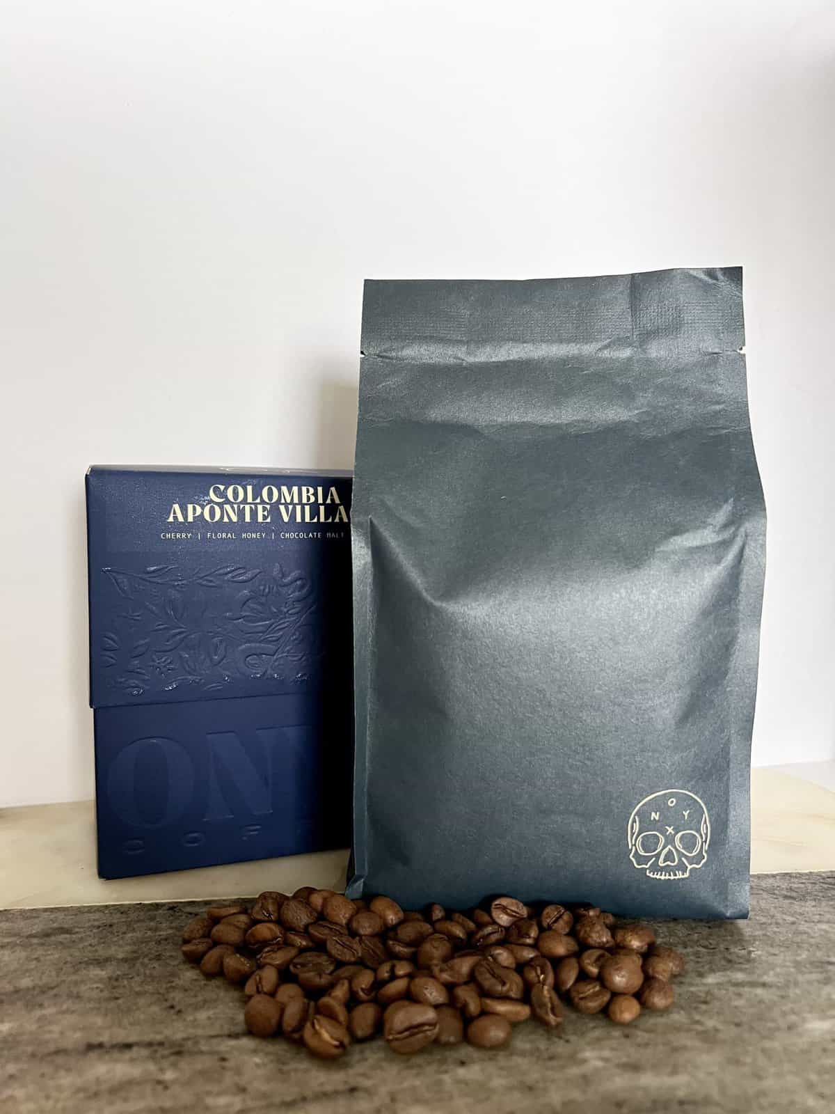 packaging-of-Onyx-Coffee-Lab-Colombia-Aponte-Village-coffee-next-to-coffee-beans-and-shipping-box-scaled